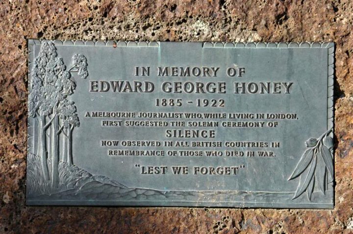 A bronze plaque on a cairn, commemorating Edward George Honey