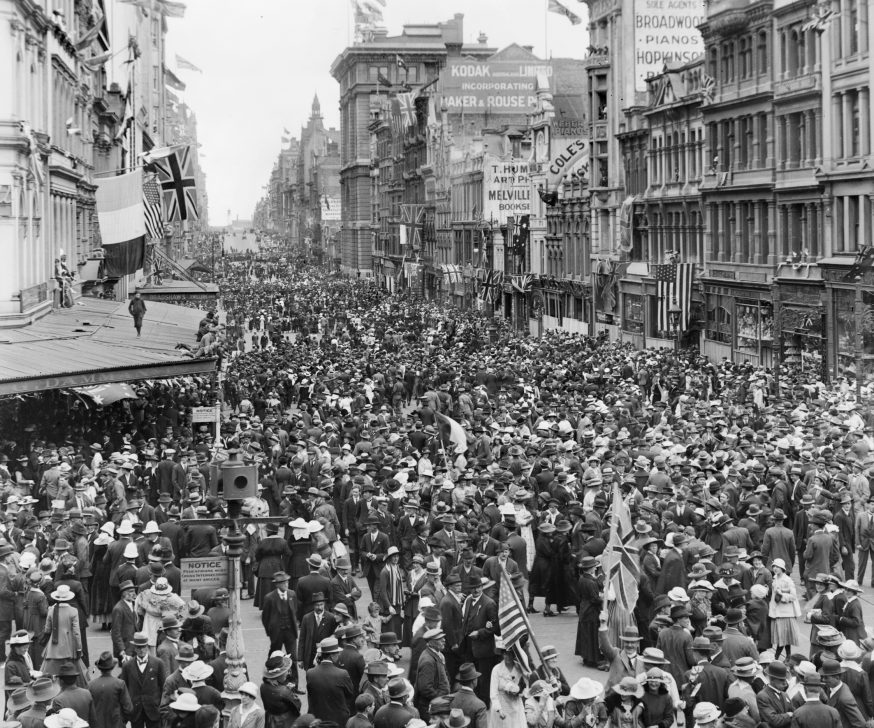 People in the streets of Melbourne celebrating the declaration of peace on 11 November 1918
