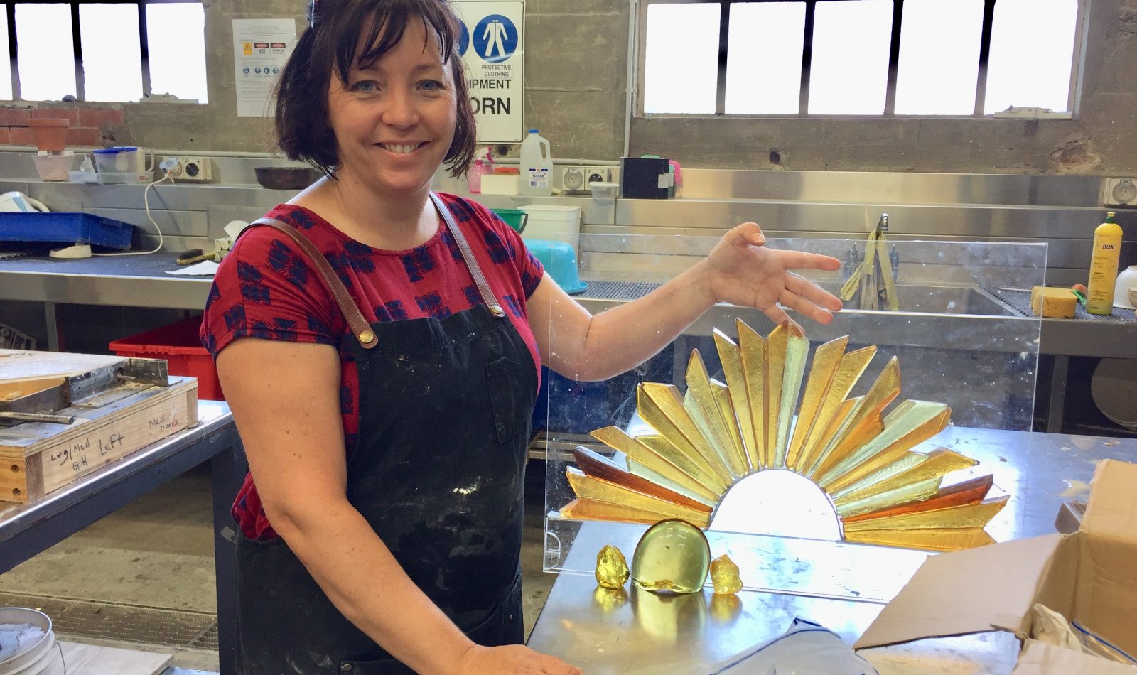 Glass artists Lisa Cahill with a maquette of her Rising Sun sculpture