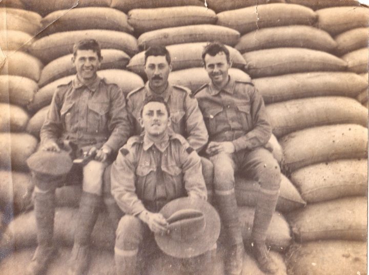 A group portrait of Australian soldiers (Ben Champion and his mates) seated on hessian bags