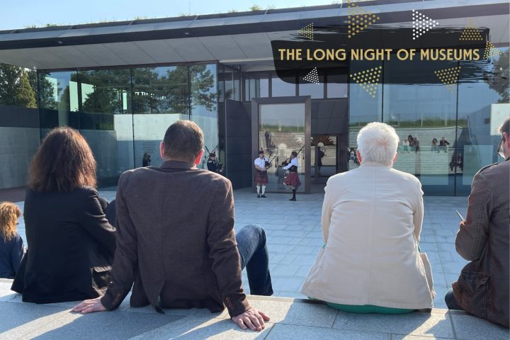Spectators gathered in the courtyard of the Centre to listen to the bagpipe performance.