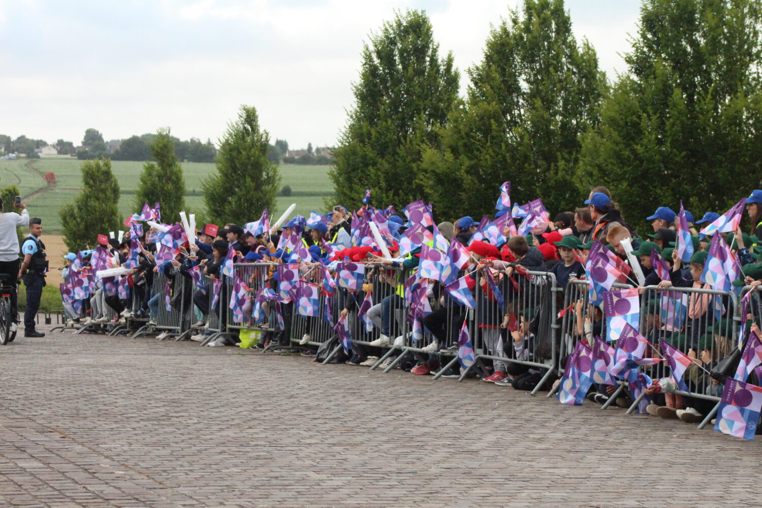 Young spectators waiting for the Olympic Torch Relay to pass.