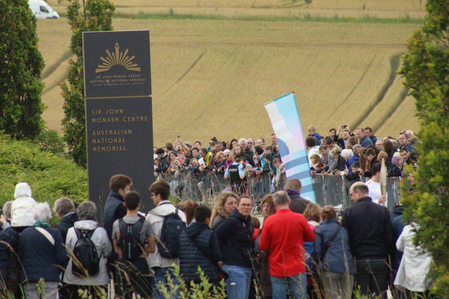 Spectators waiting for the Olympic Torch Relay to pass.