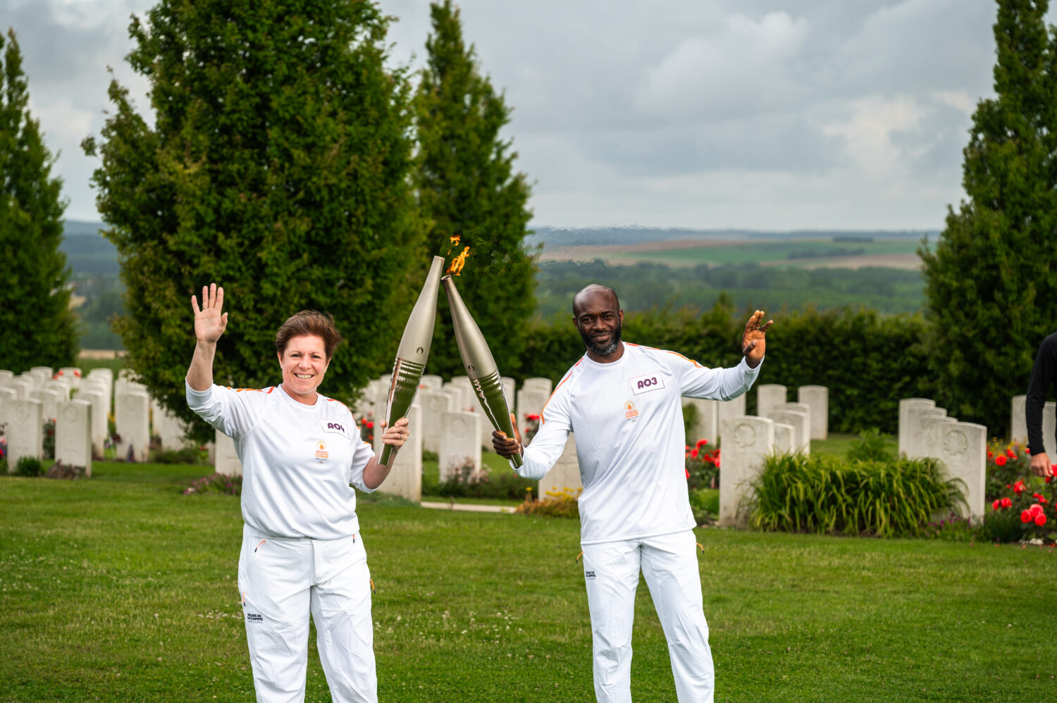 Relay runners Athos Felemou and Floriane Bormans performing the "torch kiss" at the relay handover.