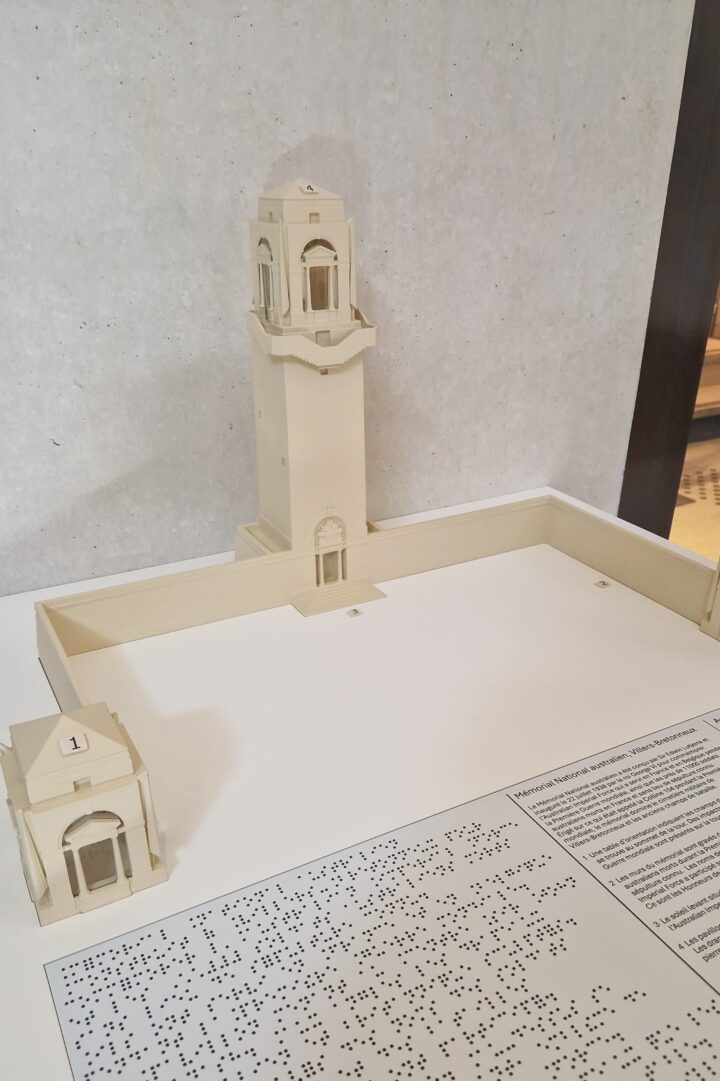 Tactile model of the Australian National Memorial with Braille inscriptions.