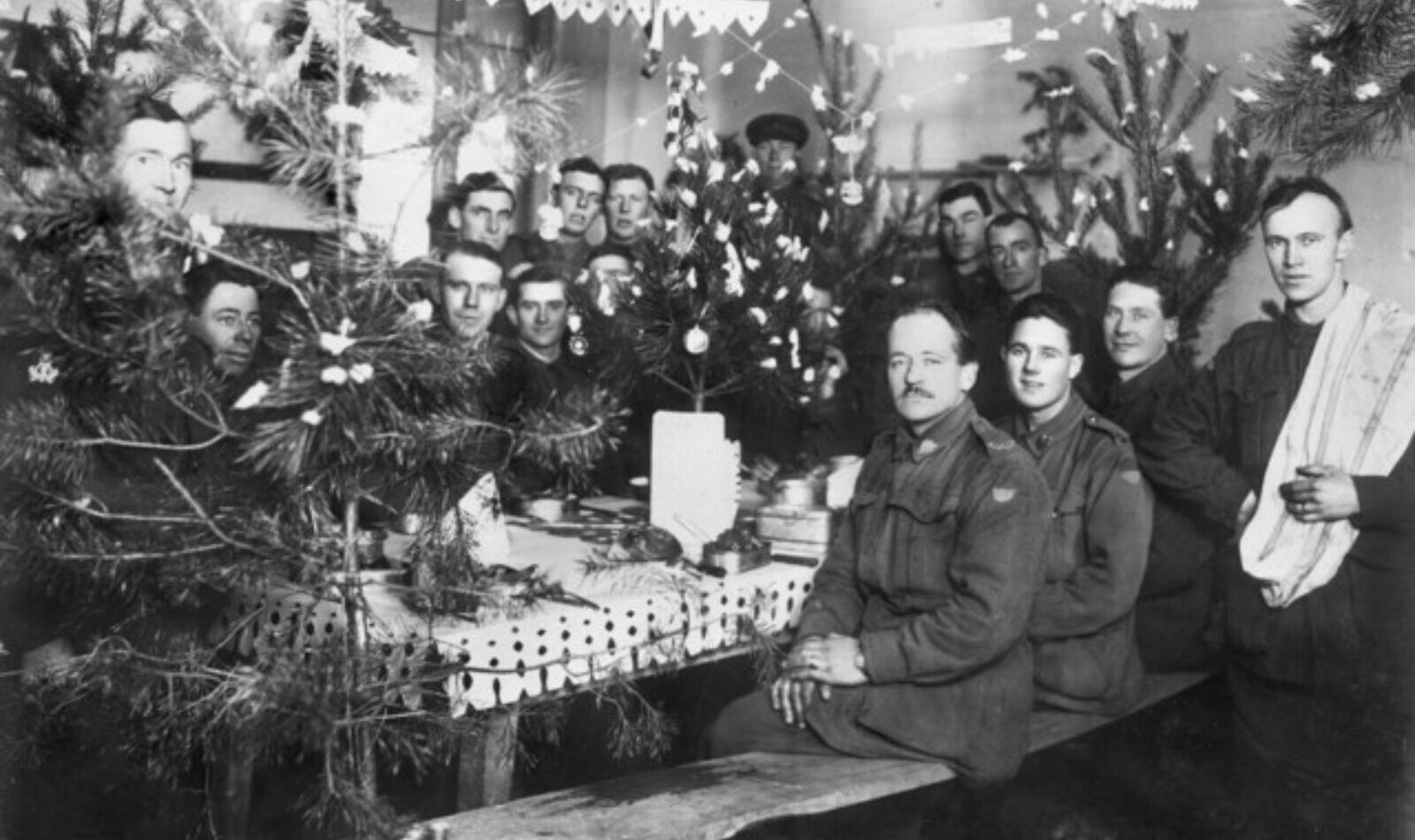 Group portrait of members of the 50th battalion band at Christmas dinner, in Dinant, Belgium on Christmas day 1918