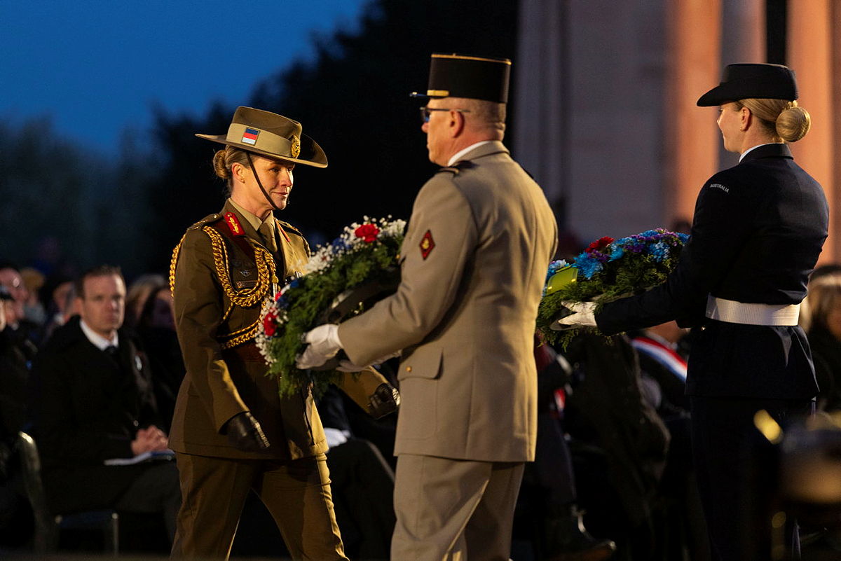 Wreath bearers presenting a floral tribute to Lieutenant General Susan Coyle.