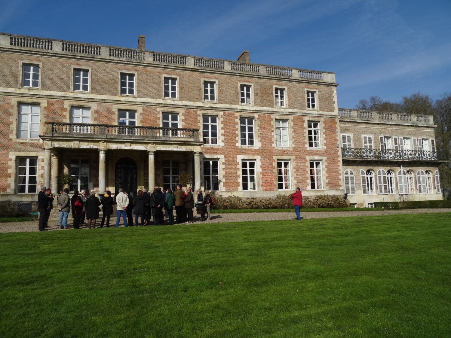 People gathered in front of the chateau