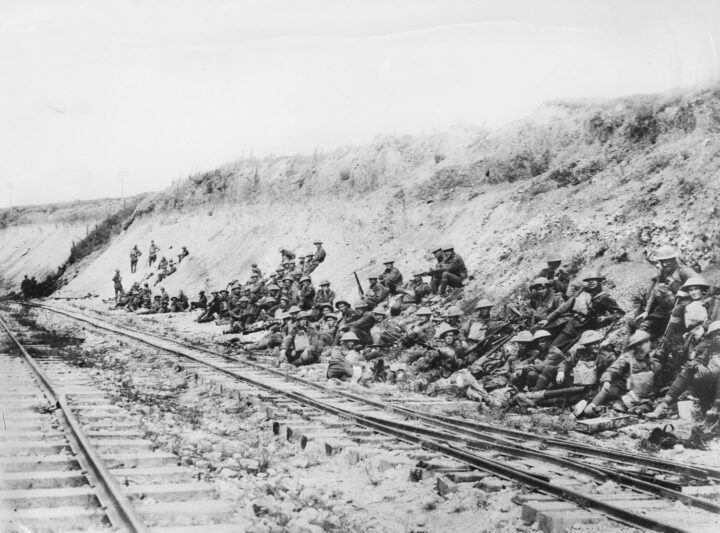 Members of the 24th Infantry Battalion resting on their way to the front line, after crossing the Somme in order to join in the operations at Mont St Quentin ©AWM E03202