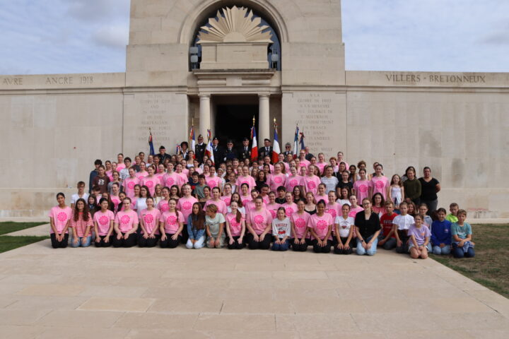 The singers and flag-bearers gathered at the foot of the memorial